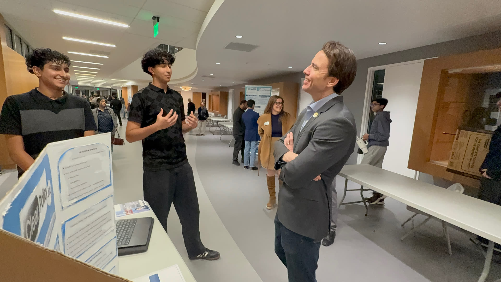 Presenting ClearPolicy to Congressman Kevin Kiley beside the project display