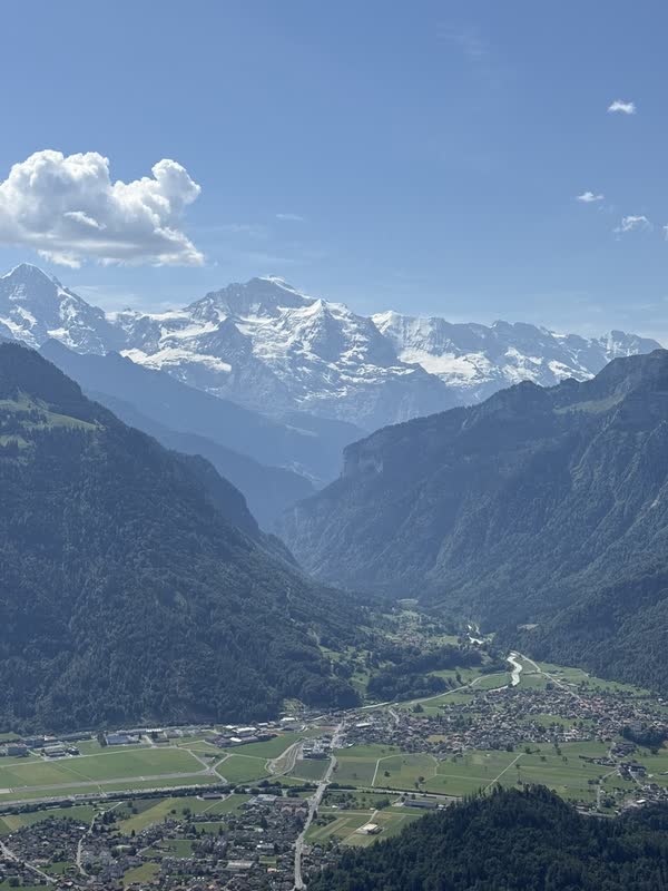 A Swiss valley framed by snow-covered peaks near Interlaken