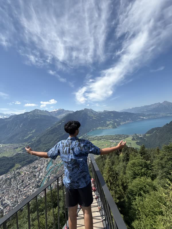 Pranil taking in lakes and mountain ridges from an overlook near Interlaken