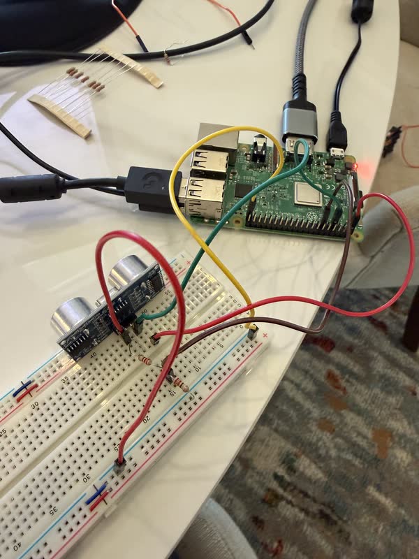 Raspberry Pi wired to a breadboard and ultrasonic sensor