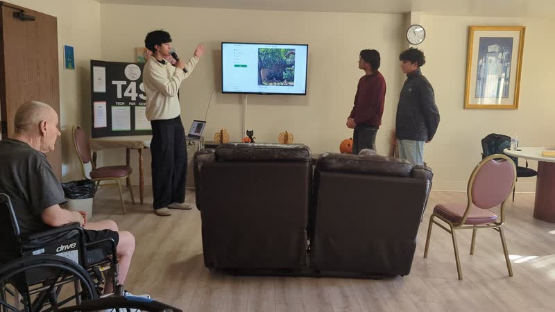 Presenting a Tech4Silvers laptop demo to residents