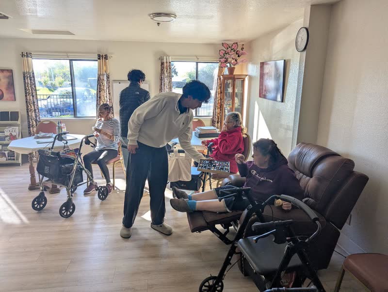 Sharing photos with residents during a Tech4Silvers visit