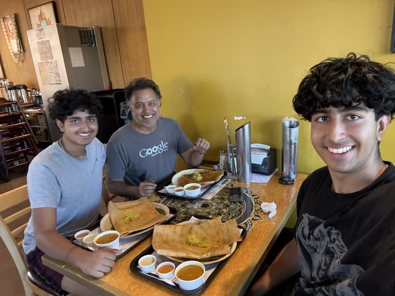 Sharing dosas with family at a neighborhood restaurant